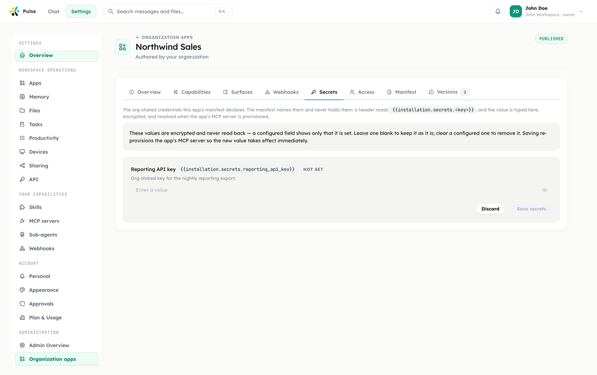 The Secrets tab of an app's authoring page, where org-shared secret values and the managed-auth client secret are entered write-only